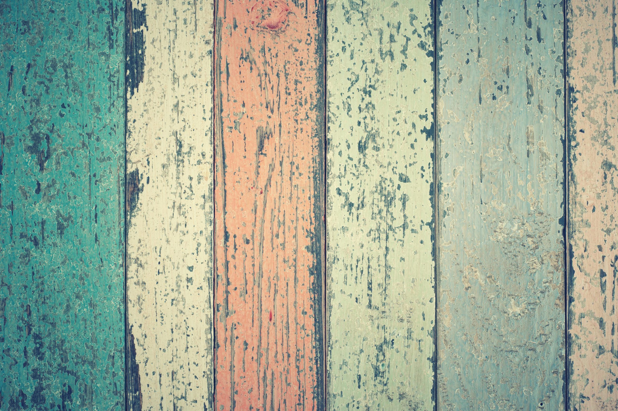 A colorful rustic wooden planks background with a weathered texture and vintage appeal.